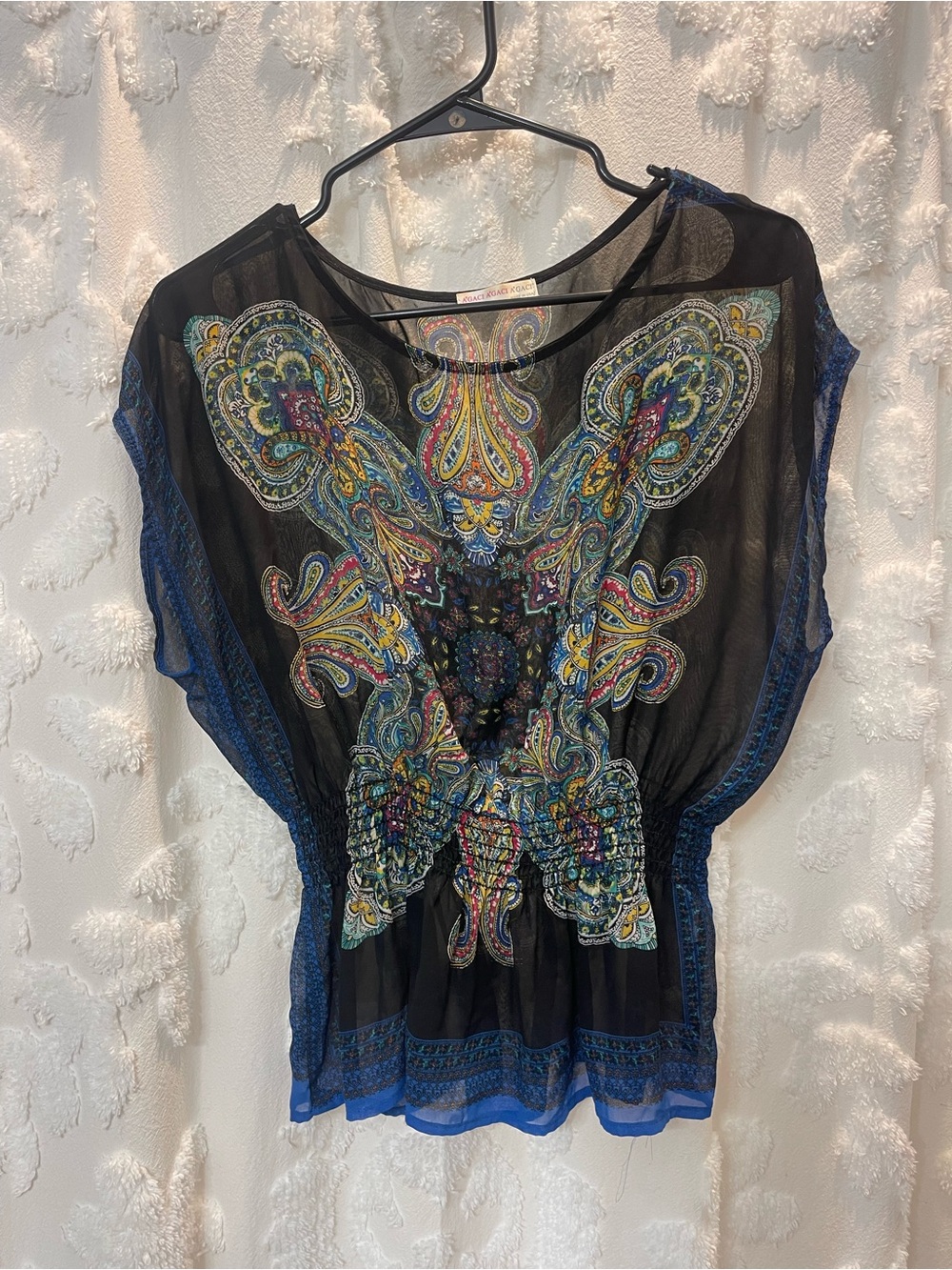 Black sheer mesh top with colorful paisley print and ruched detail